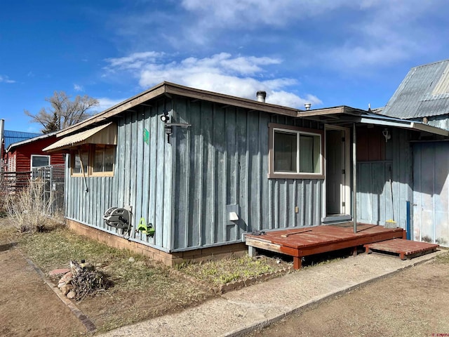 view of property exterior featuring a deck