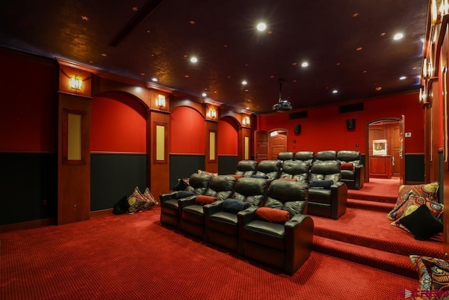 home theater with carpet flooring and crown molding