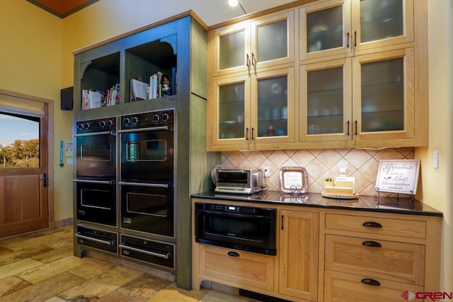 kitchen with double oven, backsplash, and light tile floors