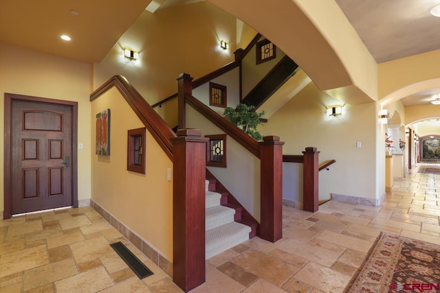 staircase with light tile flooring