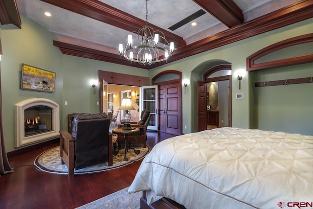 bedroom featuring an inviting chandelier, dark hardwood / wood-style flooring, and beamed ceiling