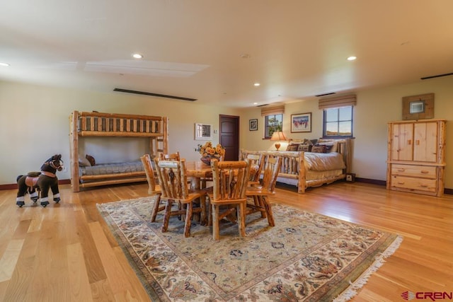 dining space with light hardwood / wood-style flooring