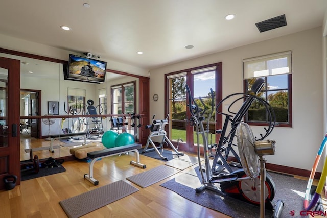 exercise area featuring light hardwood / wood-style flooring