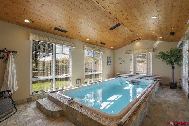 playroom with light tile flooring, a pool with hot tub, vaulted ceiling, and wooden ceiling