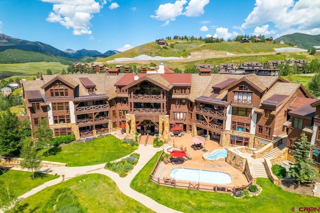 drone / aerial view featuring a mountain view