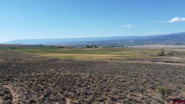 mountain view featuring a rural view