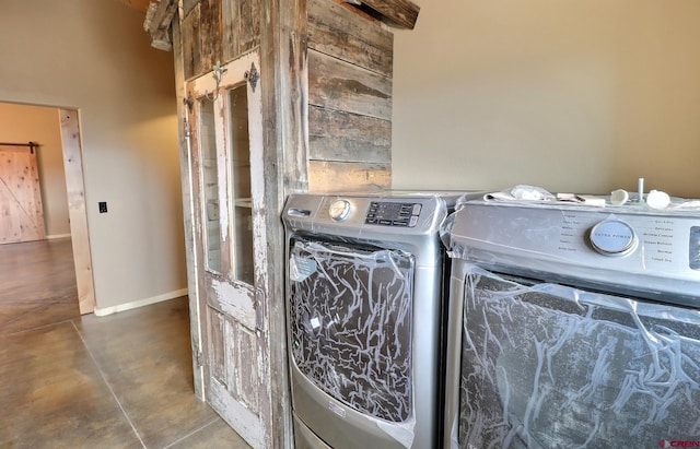 laundry area with washing machine and clothes dryer