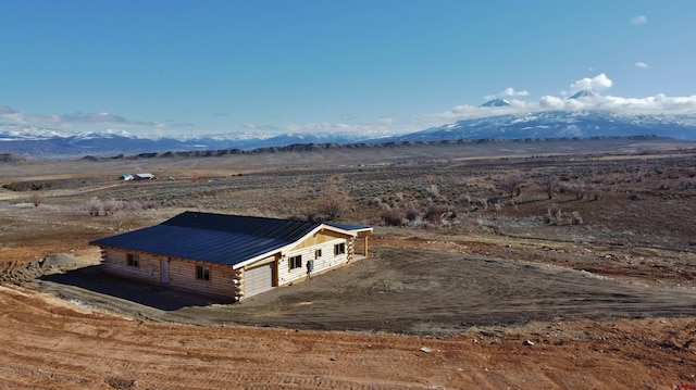 birds eye view of property featuring a mountain view and a rural view