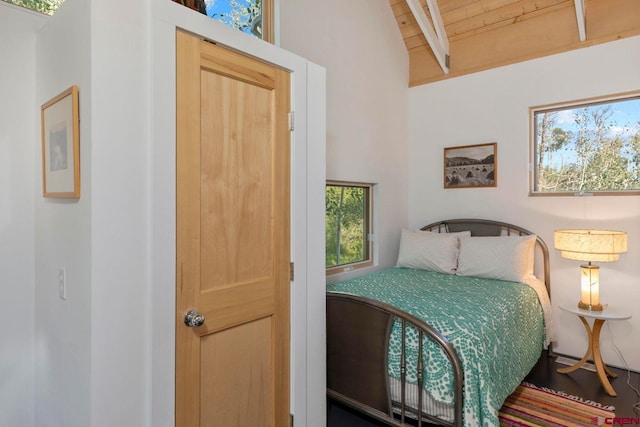 1006 Top Of The World Dr, Placerville, CO 81430 - bedroom with wood ceiling, wood-type flooring, and vaulted ceiling with beams