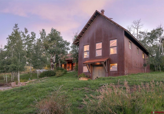 1006 Top Of The World Dr, Placerville, CO 81430 - back house at dusk featuring a yard