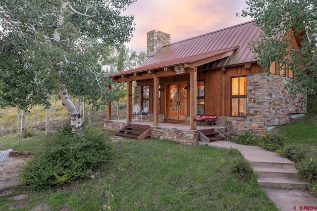 1006 Top Of The World Dr, Placerville, CO 81430 - view of front of home featuring a lawn and covered porch