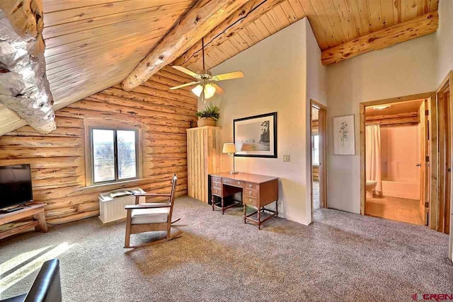 sitting room featuring ceiling fan, rustic walls, carpet, and wood ceiling