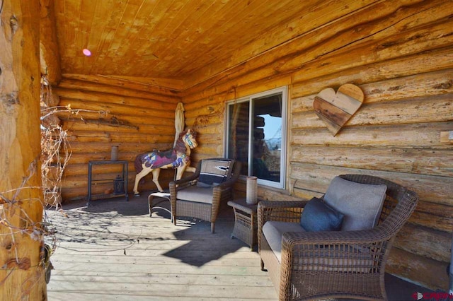 wooden deck with an outdoor hangout area