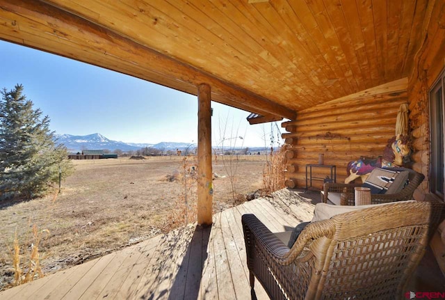 wooden terrace featuring a mountain view