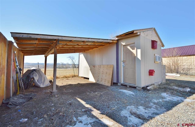 view of outdoor structure with a carport