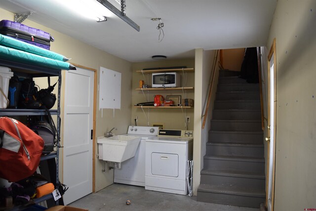 laundry area with independent washer and dryer