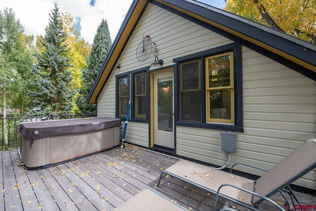 deck featuring a hot tub