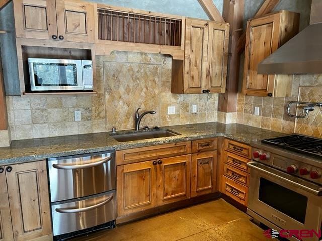 kitchen with sink, stainless steel appliances, tasteful backsplash, and wall chimney exhaust hood