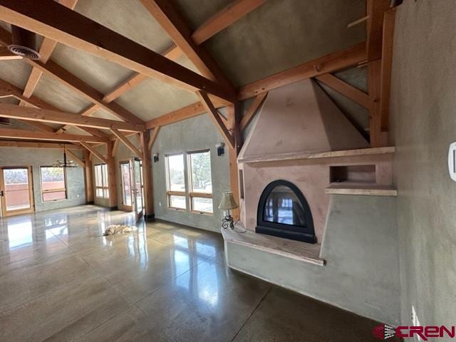 interior space featuring lofted ceiling with beams