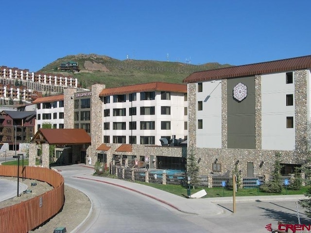 view of building exterior featuring a mountain view