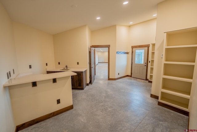 interior space featuring concrete floors and sink