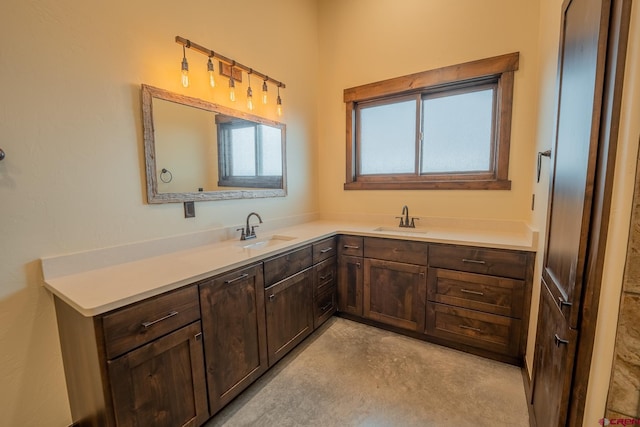 bathroom with concrete flooring and vanity