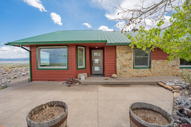 rear view of house featuring a patio