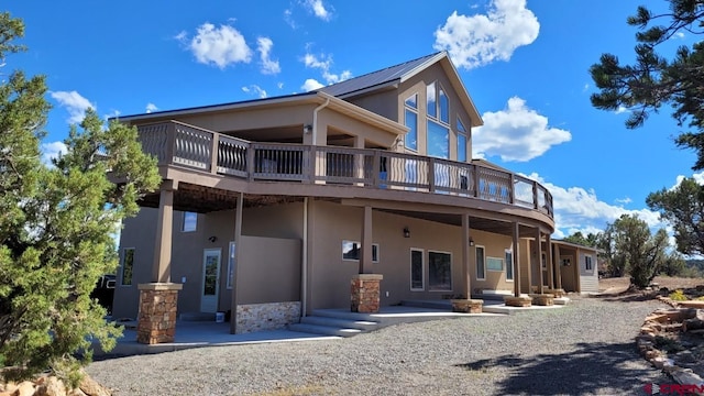 back of property featuring a patio area