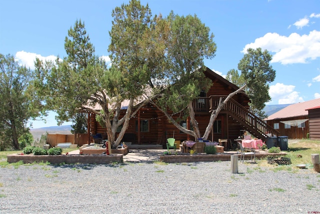 cabin featuring a patio area and a deck