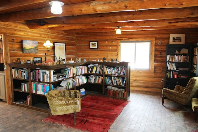 living area featuring log walls, beamed ceiling, and wood ceiling