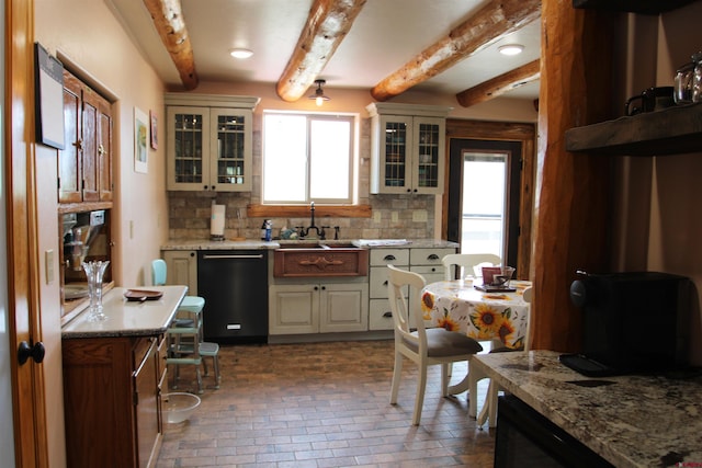 kitchen featuring sink, beam ceiling, tasteful backsplash, and dishwasher