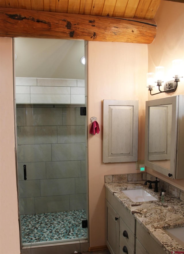 bathroom with walk in shower, dual vanity, and wood ceiling