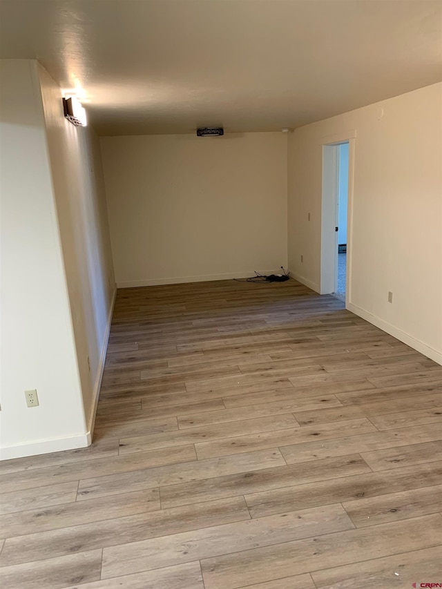 spare room featuring light hardwood / wood-style flooring