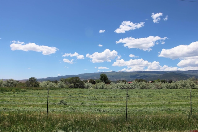 mountain view featuring a rural view