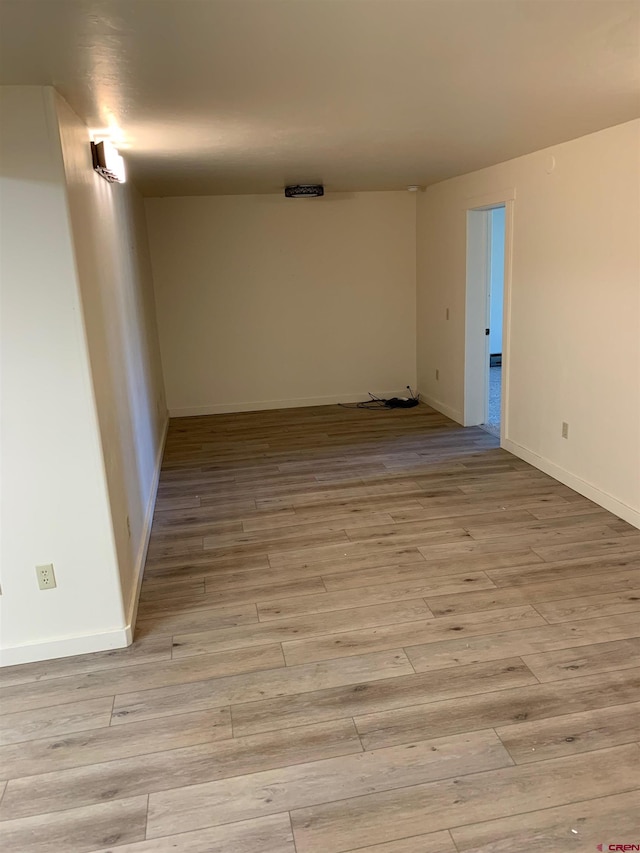 spare room featuring light hardwood / wood-style floors