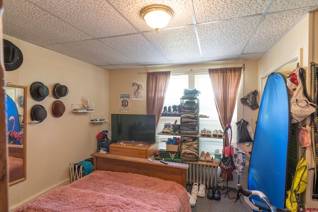 bedroom featuring a paneled ceiling