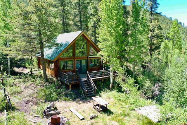 rear view of house with a wooden deck