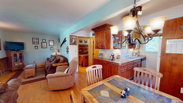 dining area featuring light hardwood / wood-style floors and sink