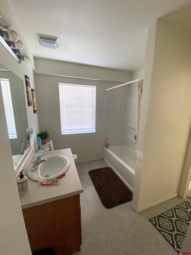 bathroom with shower / tub combo and vanity