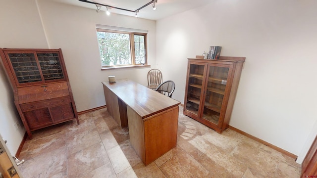 office featuring light tile flooring and rail lighting