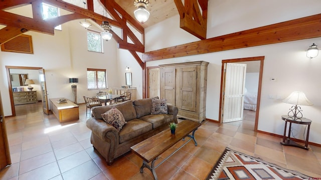 tiled living room with high vaulted ceiling