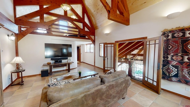 tiled living room with high vaulted ceiling and beamed ceiling