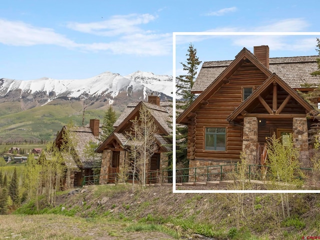 log cabin with a mountain view