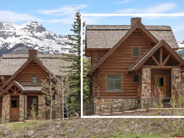 log home with a mountain view and a porch