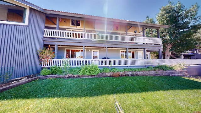 exterior space featuring a yard and a balcony