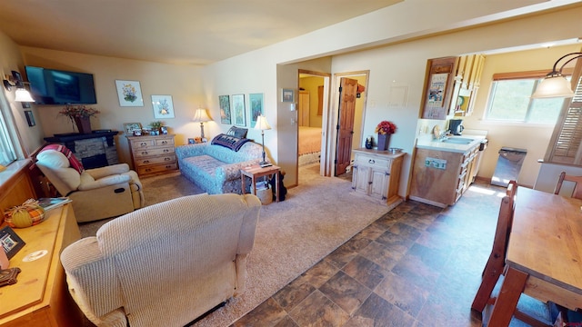 living room featuring dark carpet and sink