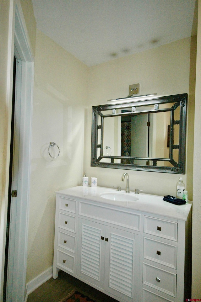 bathroom featuring vanity and wood-type flooring