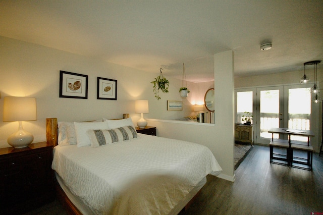 bedroom with dark wood-type flooring and french doors