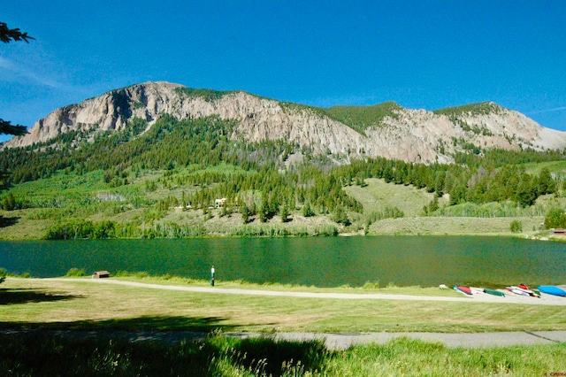 view of mountain feature with a water view