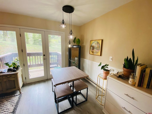 dining area featuring dark hardwood / wood-style flooring and french doors